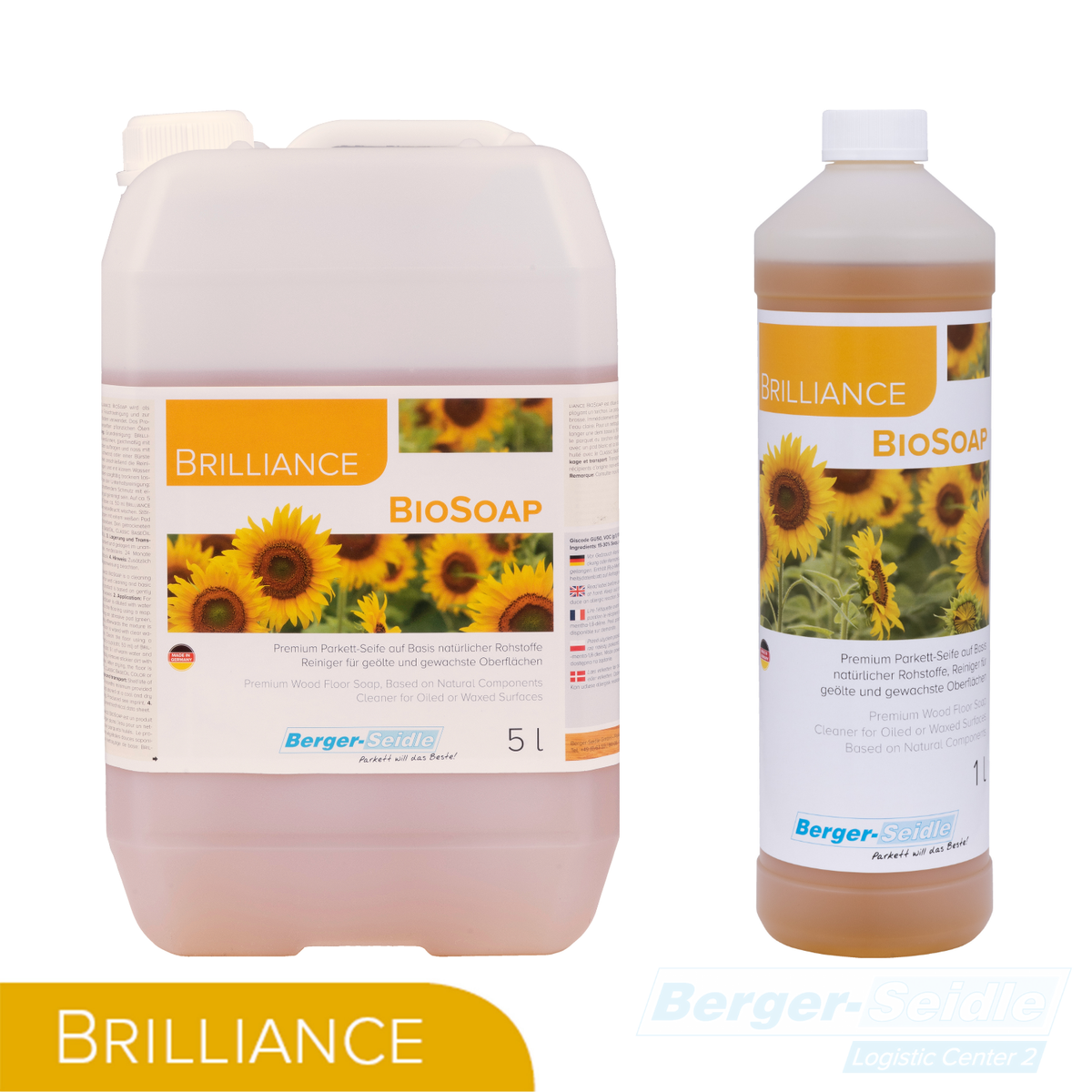 Zwei Behälter von Brilliance BioSoap mit Sonnenblumenmotiven auf den Etiketten: ein rechteckiger 5-Liter-Krug mit Griff und eine zylindrische 1-Liter-Flasche mit weißem Verschluss.