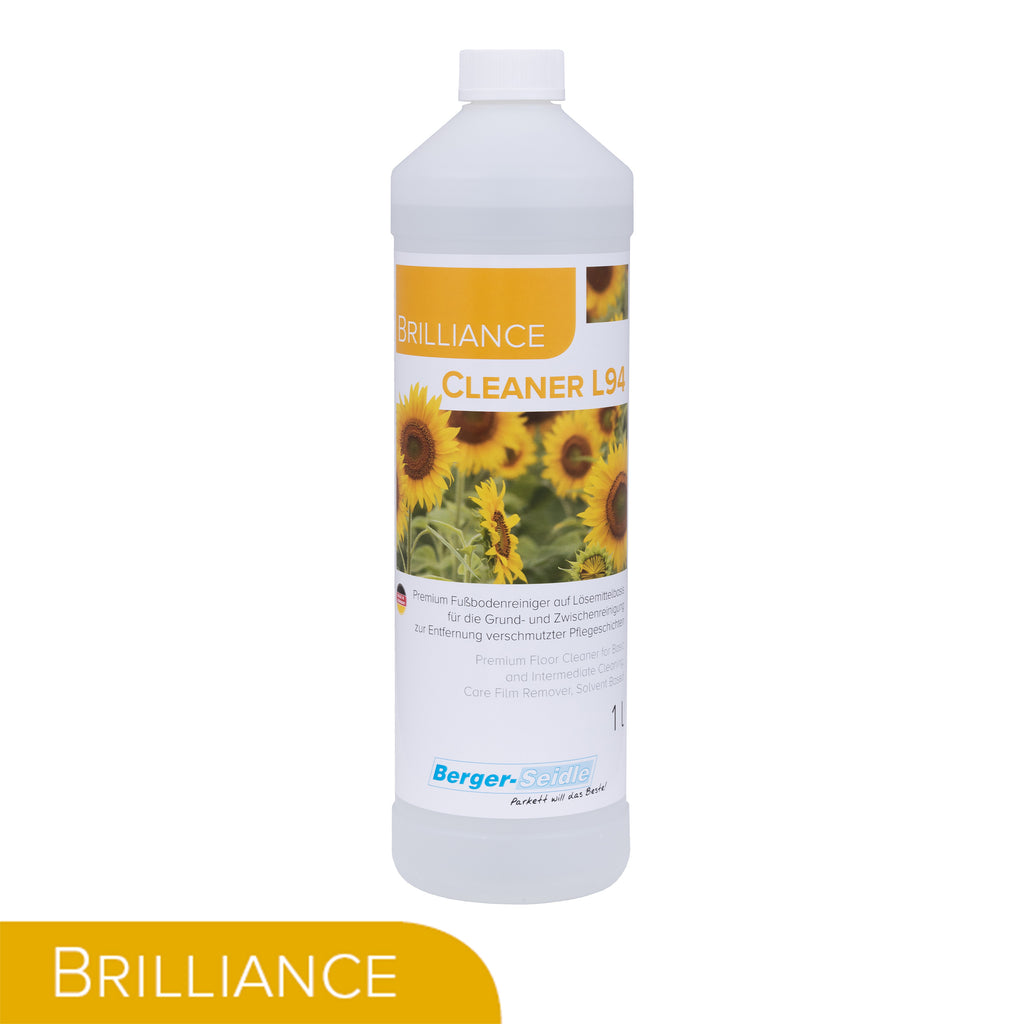 Eine weiße 1-Liter-Flasche Brilliance Cleaner L94 trägt ein Etikett mit Sonnenblumen und Produktinformation. In der unteren linken Ecke befindet sich ein gelbes Banner mit dem Wort "BRILLIANCE" in weißer Schrift.